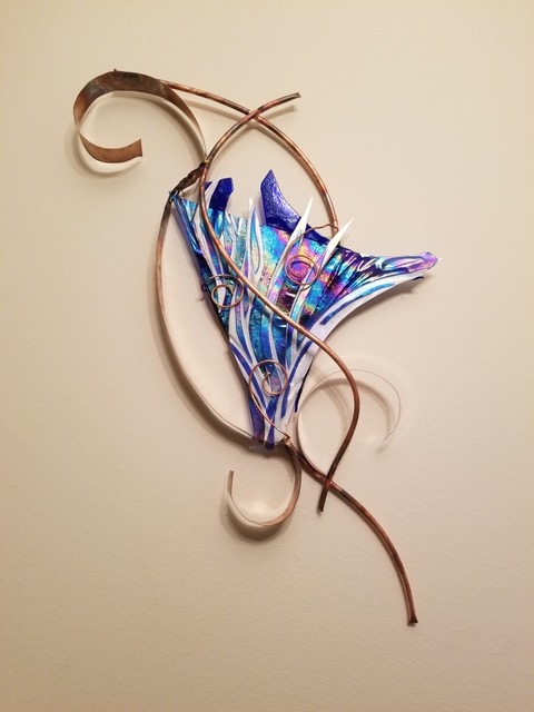 Blue Whimsy: blue iridescent fused glass in a fan shape, framed by a curling copper armature.