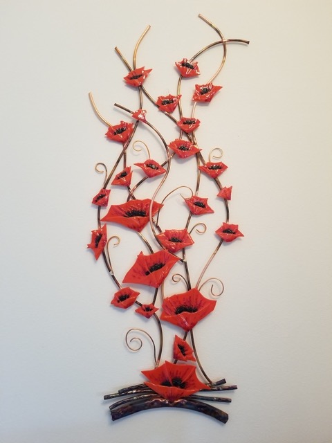 Flaming Poppies: red fused-glass poppies cascading down a tall copper-stem armature.