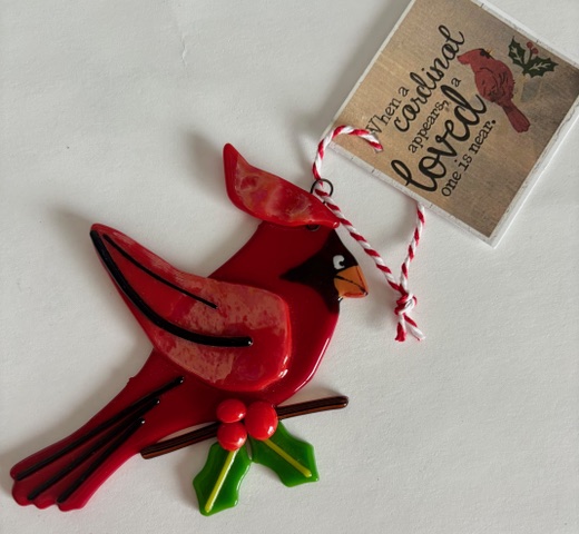 Cardinal Ornament: a red fused-glass cardinal on a holly branch.