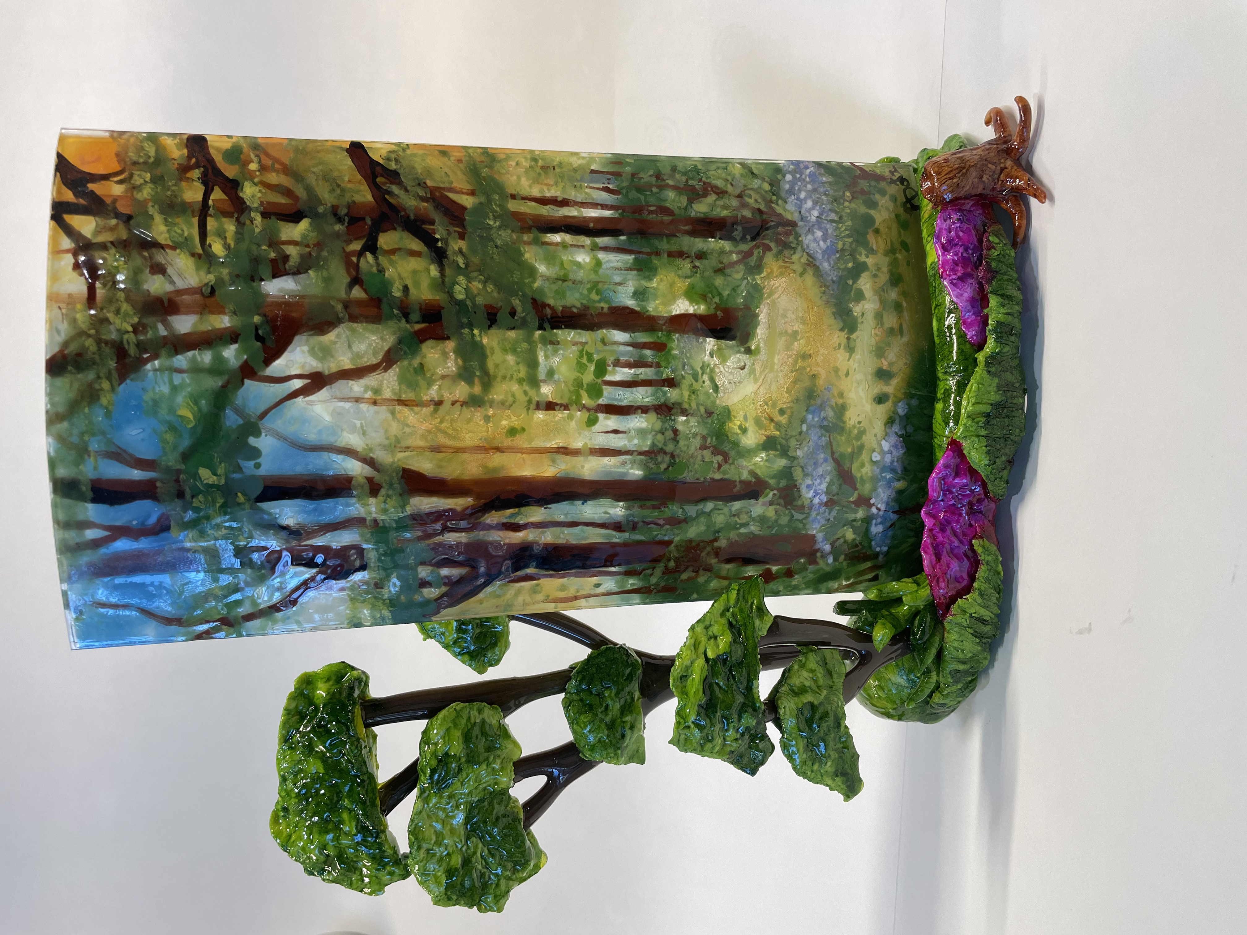 Fused-glass vase with leaf motif.