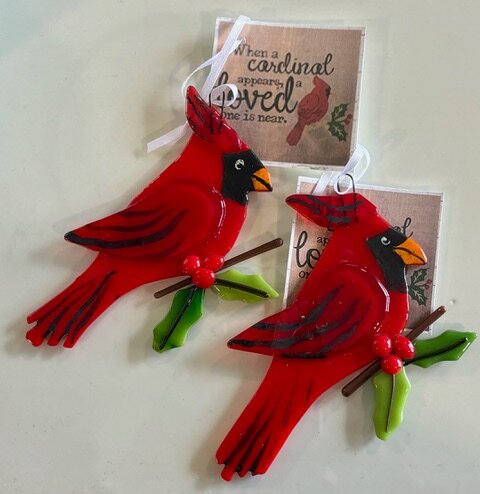 Cardinal: red fused-glass cardinal ornaments perched on a holly branch.