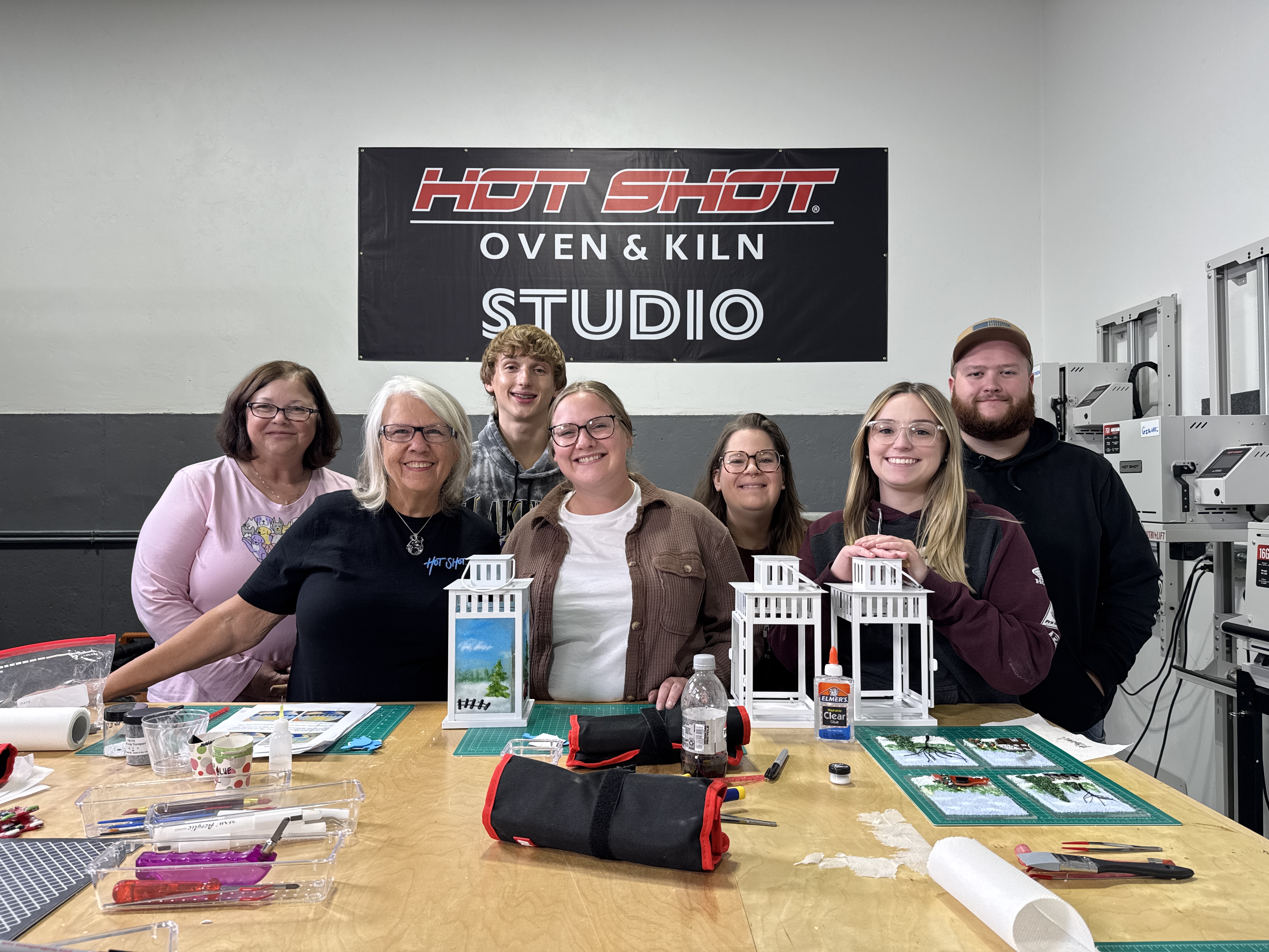 Lead image of the Studio room: Annie at the kiln studio with students.